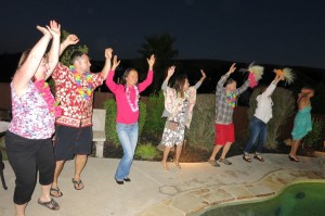 Ryan and Xeno learning hula with the ladies