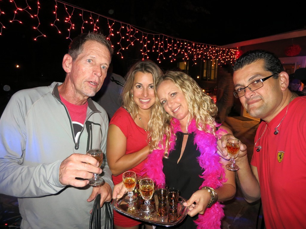 Jeff and Gary with the birthday girl Teresa and Angie serving shots