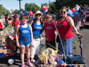 The Mittones and Lorenzinis with wagons full of candy